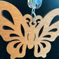Detail of the openwork butterfly design and wood grain