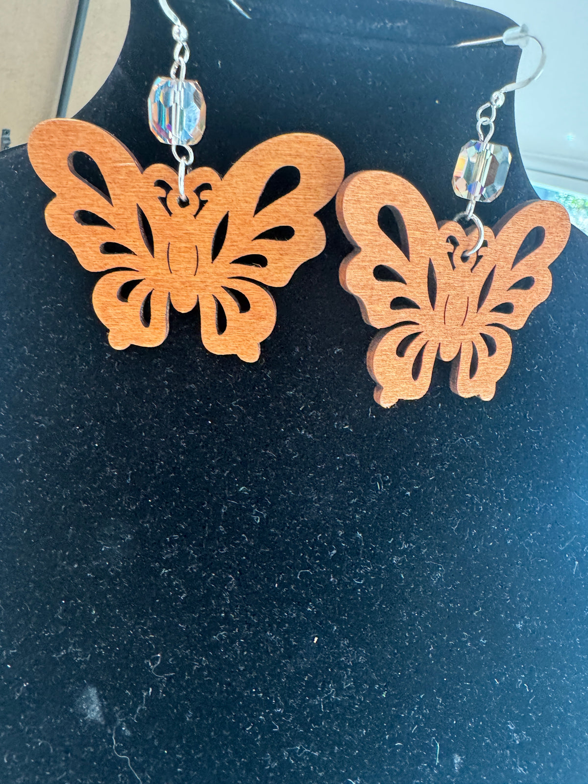 Pair of wooden butterfly earrings with crystal accents