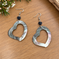 Open-heart black lip shell earrings with faceted black beads