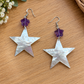 Mother-of-pearl star earrings with small purple flower accents