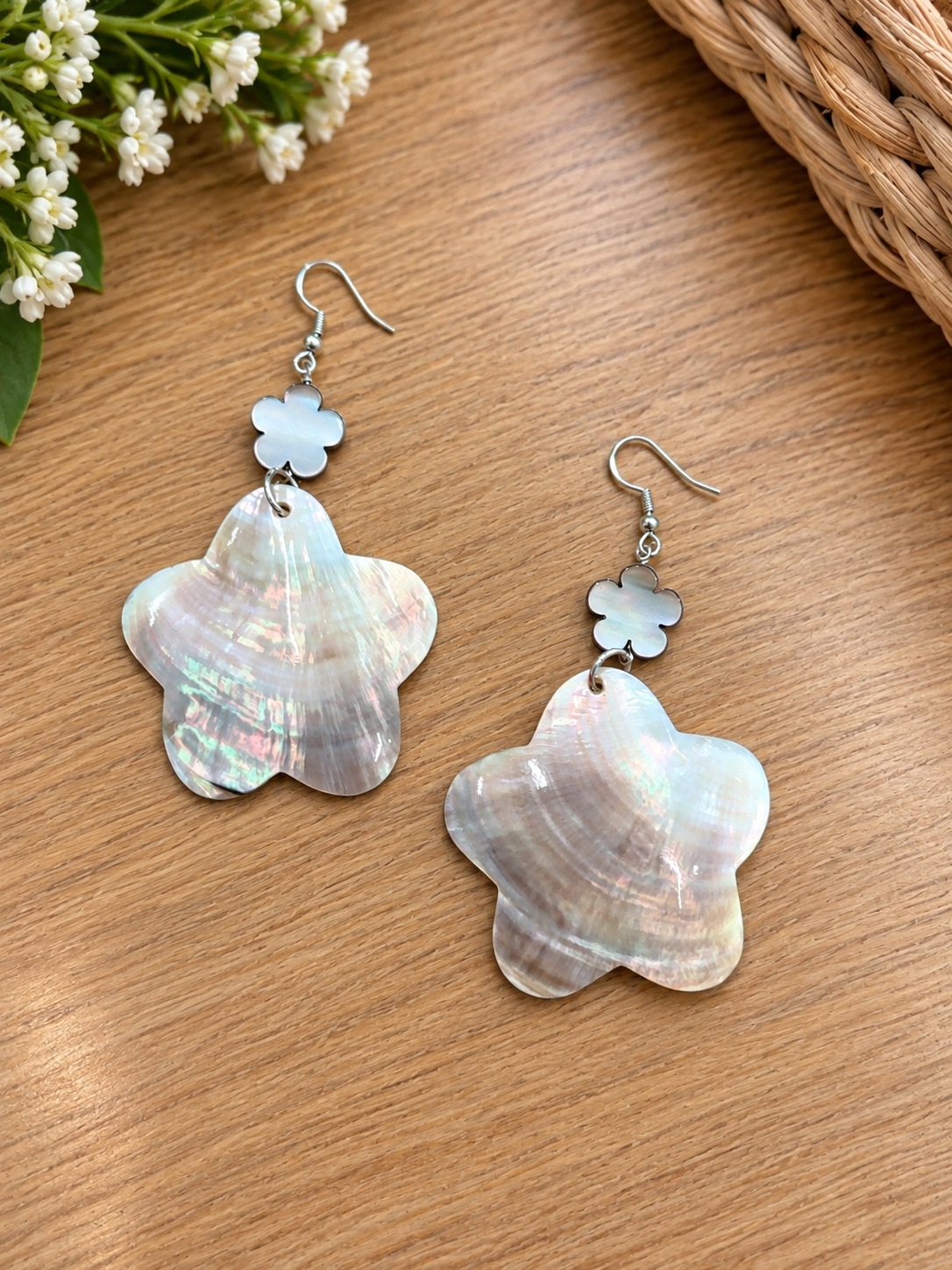 Large iridescent shell flower earrings with small pale flower accents