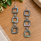 Abalone open-square earrings with bow-shaped connectors and four square drops per earring