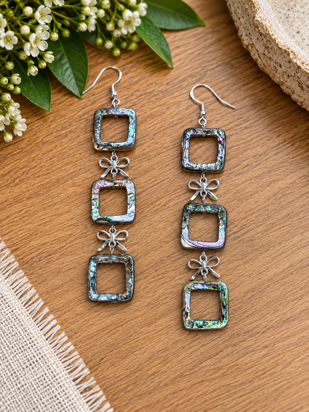 Abalone open-square earrings with bow-shaped connectors and four square drops per earring
