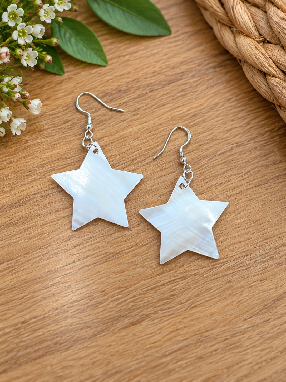 Pair of pale mother-of-pearl star earrings