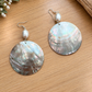 Round iridescent shell earrings with pearl accents