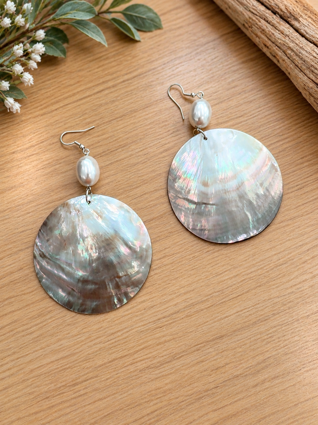 Round iridescent shell earrings with pearl accents